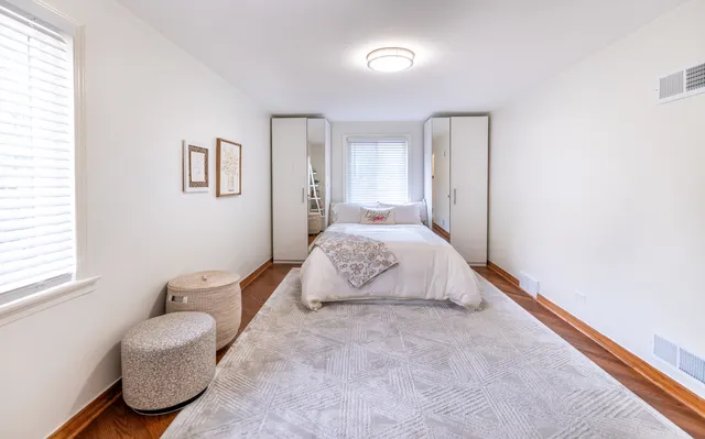 a bedroom with a bed and a couch