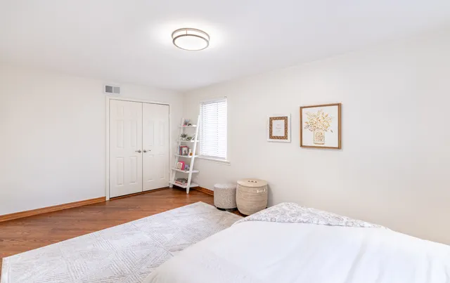 a bedroom with a bed and a cabinets