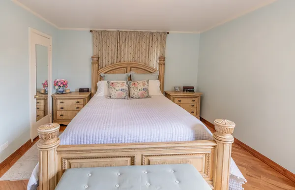 a bedroom with a bed and a closet