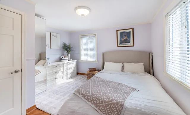 a bedroom with a bed and a couch