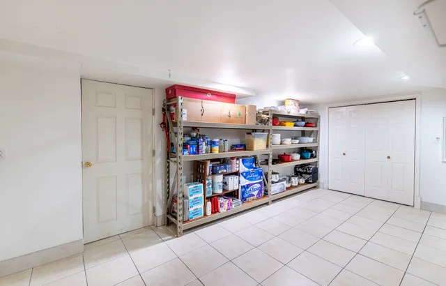 a room with storage and a white cabinets