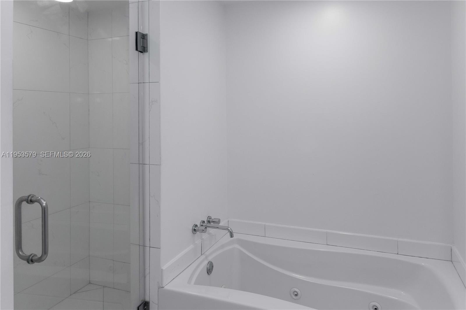 55 Southeast 6th Street, Unit 2606 Miami, FL 33131 - Photo 14 of 18 a close up of a bathtub curtain