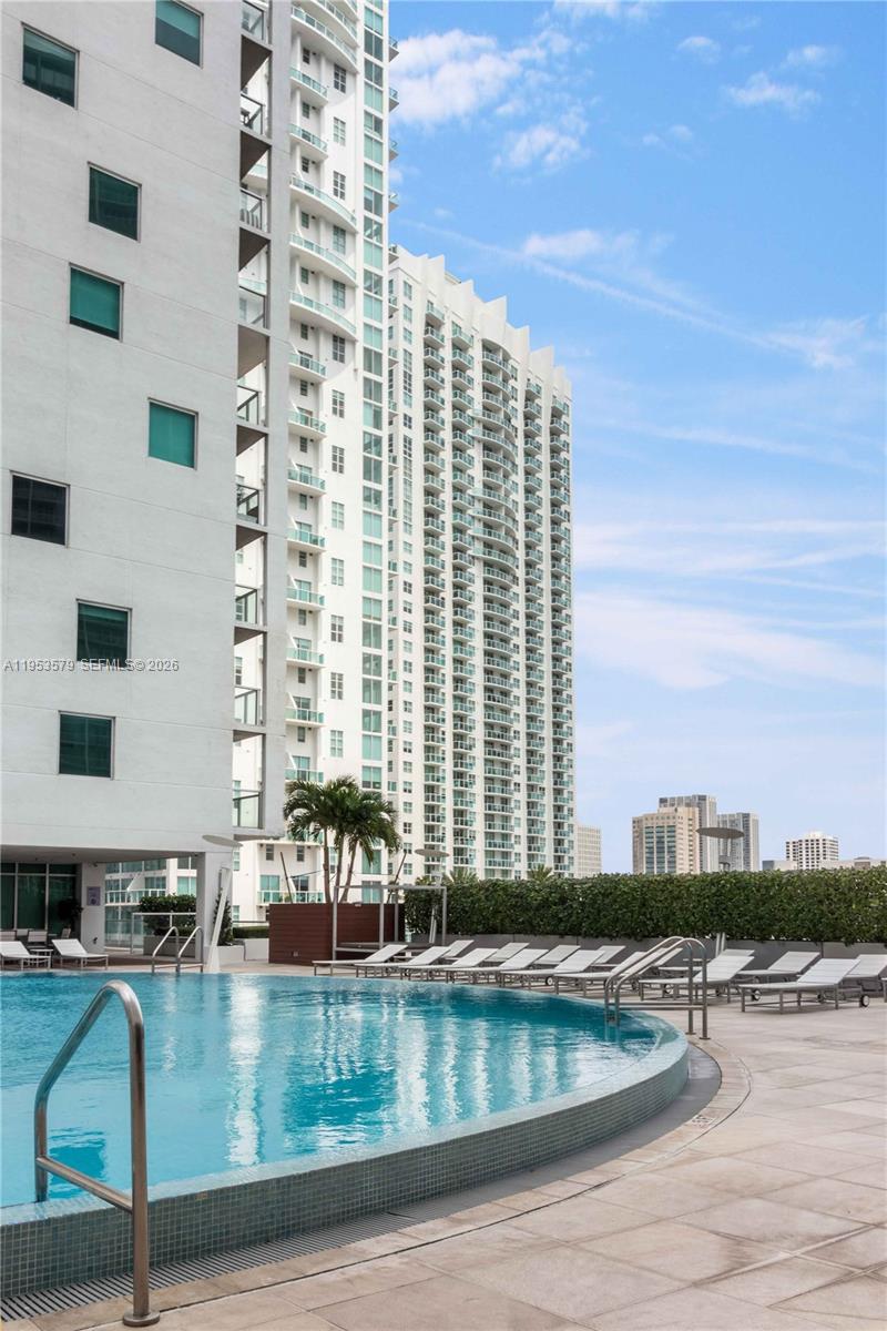 55 Southeast 6th Street, Unit 2606 Miami, FL 33131 - Photo 18 of 18 a view of swimming pool with outdoor seating