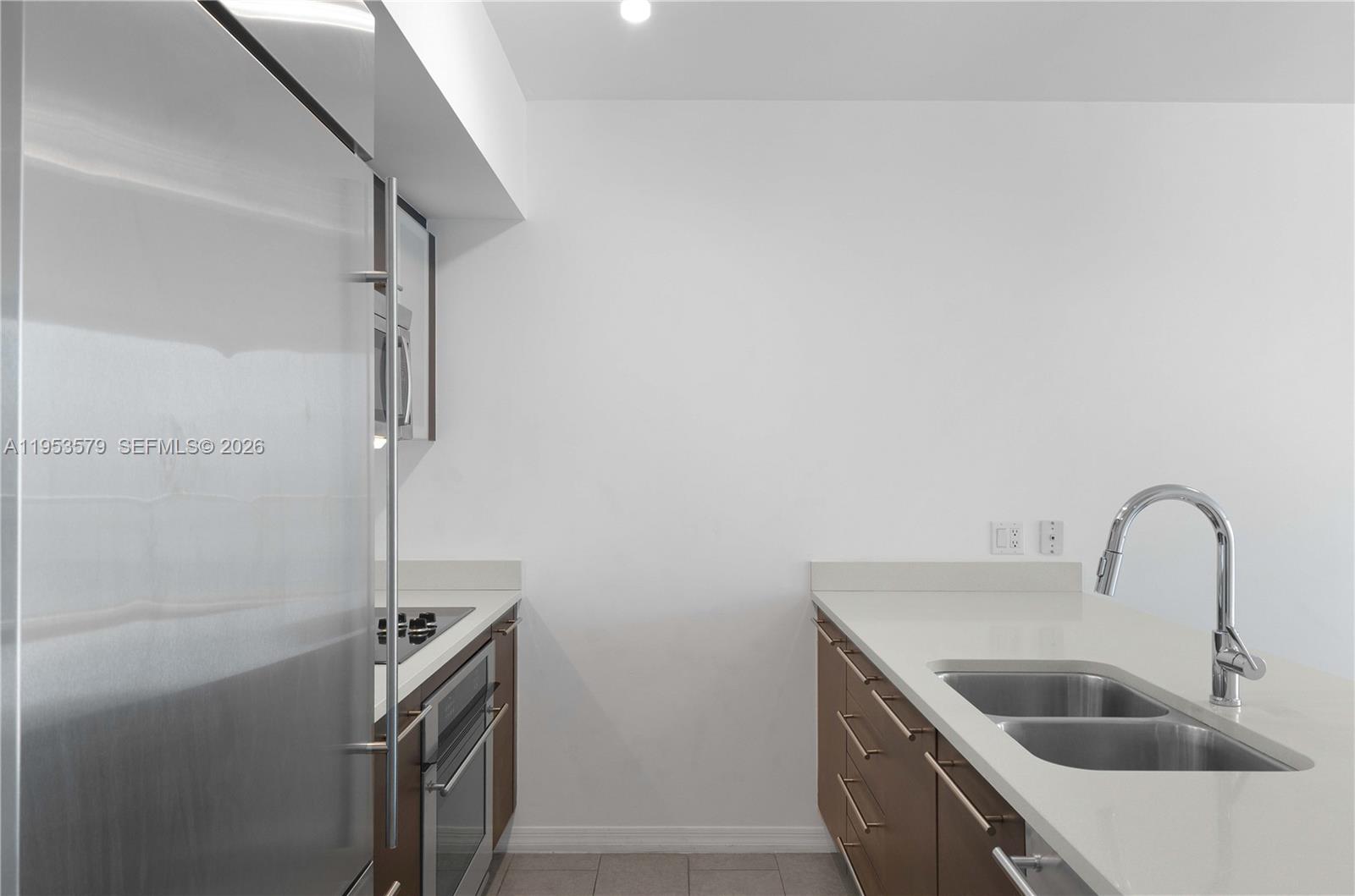 55 Southeast 6th Street, Unit 2606 Miami, FL 33131 - Photo 6 of 18 a close view of sink and tap