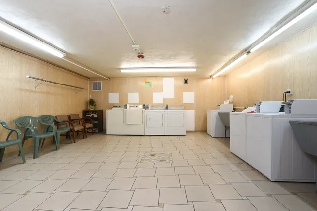 a kitchen with a sink and white cabinets