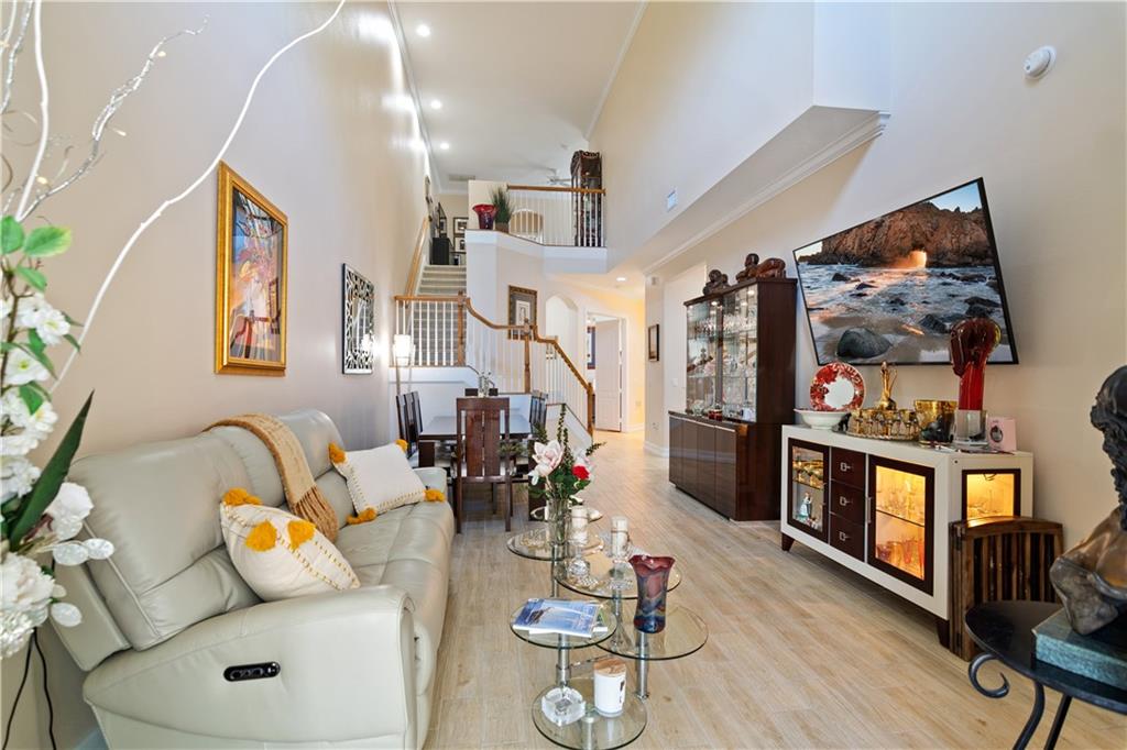 1915 Bridgepointe Circle, Unit 41 Vero Beach, FL 32967 - Photo 13 of 36 a living room with furniture and wooden floor
