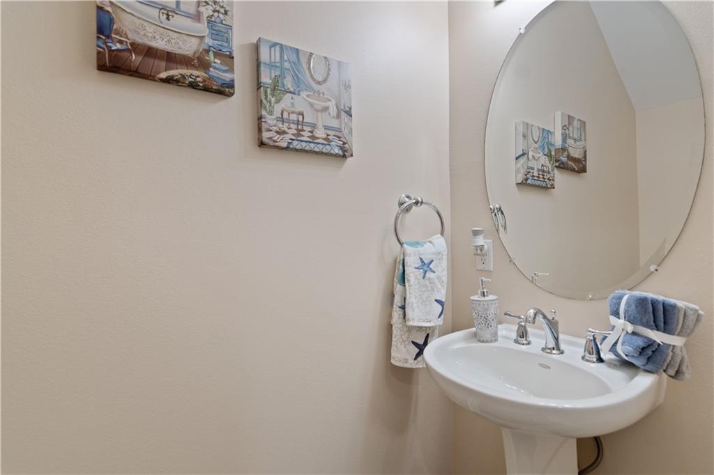 1915 Bridgepointe Circle, Unit 41 Vero Beach, FL 32967 - Photo 16 of 36 a bathroom with a sink and a mirror