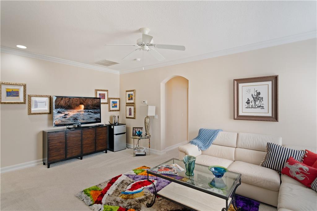 1915 Bridgepointe Circle, Unit 41 Vero Beach, FL 32967 - Photo 18 of 36 a living room with furniture kitchen view and a window