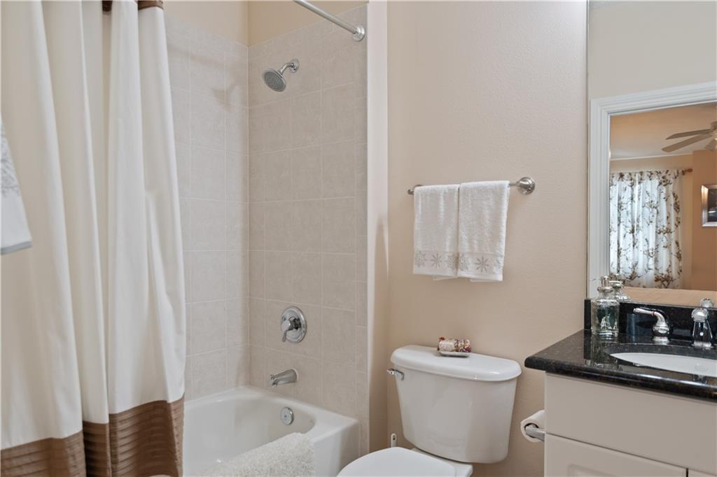 1915 Bridgepointe Circle, Unit 41 Vero Beach, FL 32967 - Photo 21 of 36 a bathroom with a sink a toilet and shower