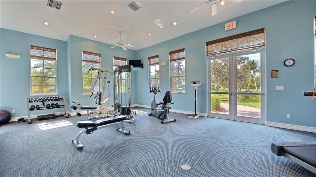1915 Bridgepointe Circle, Unit 41 Vero Beach, FL 32967 - Photo 28 of 36 a view of a room with gym equipment