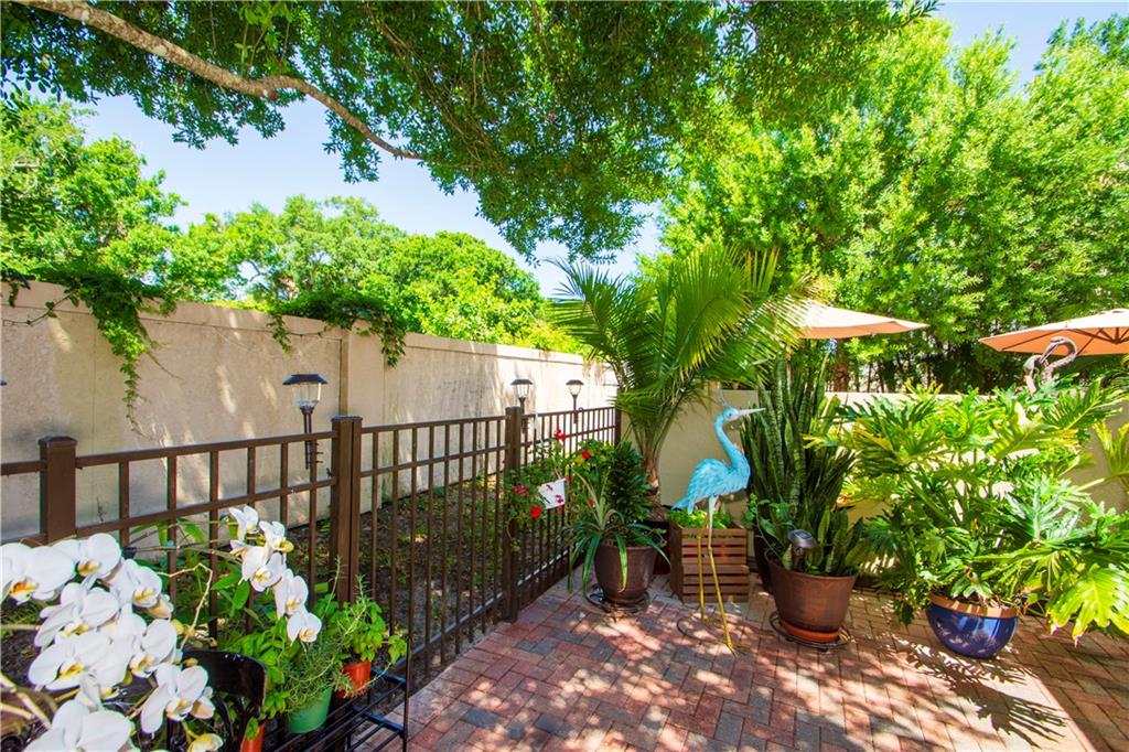 1915 Bridgepointe Circle, Unit 41 Vero Beach, FL 32967 - Photo 5 of 36 a view of a garden