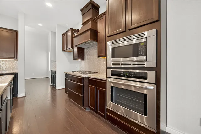 a kitchen with a stove and a microwave