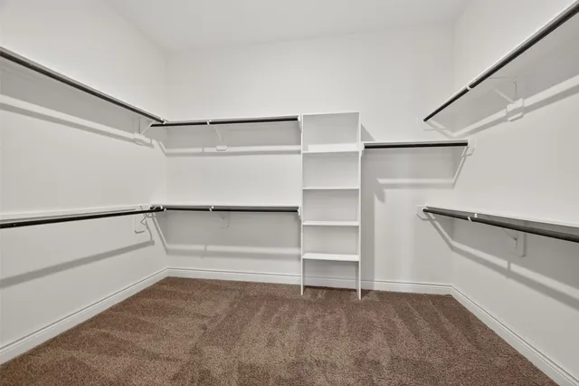 a view of an empty walk in closet