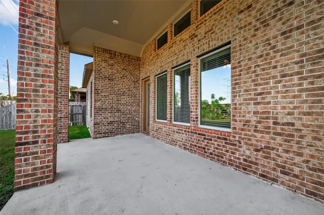 a view of a brick house many windows