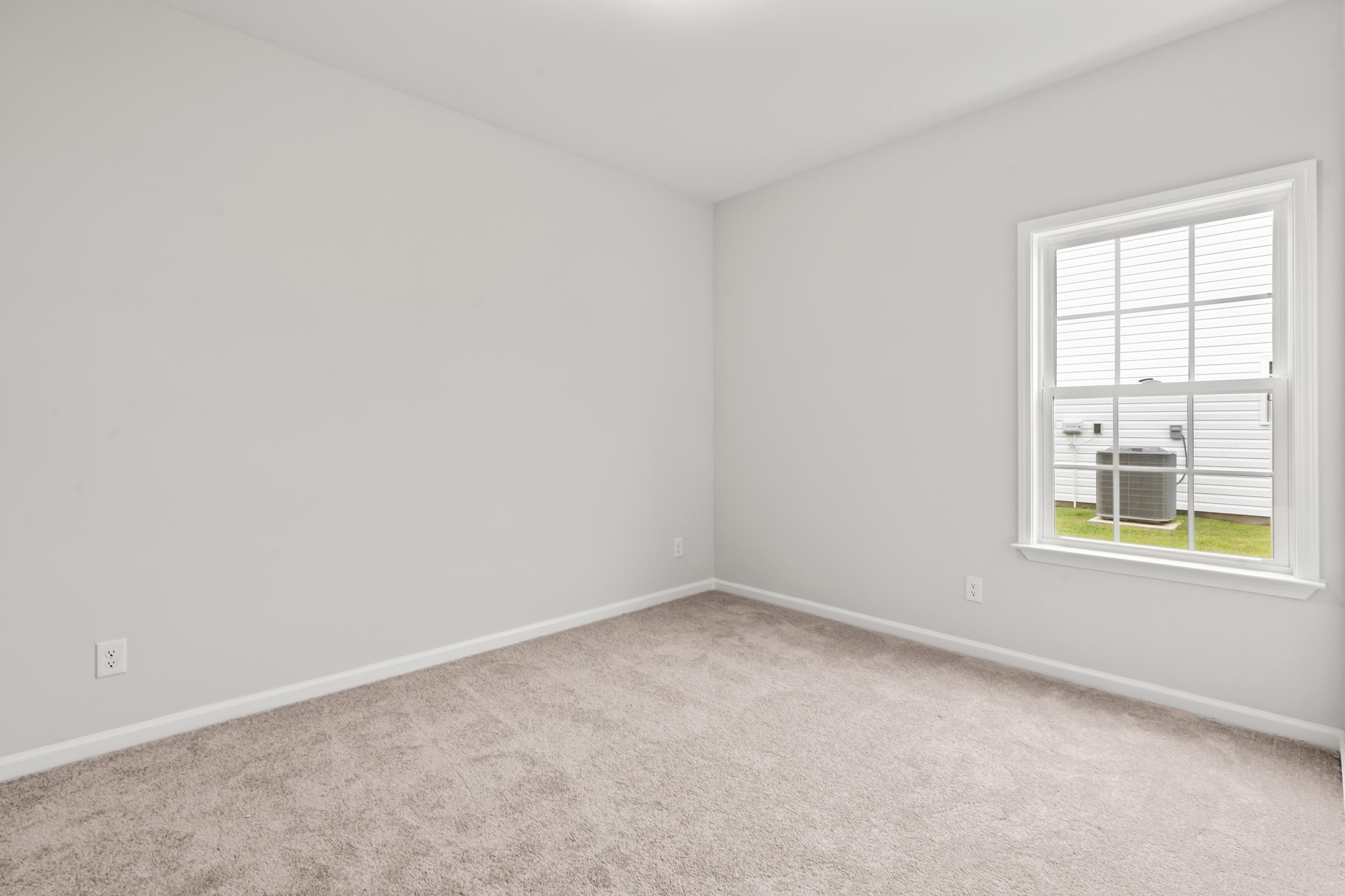 231 Stillbrook Drive Longs, SC 29568 - Photo 11 of 38 Spare room with light carpet and baseboards