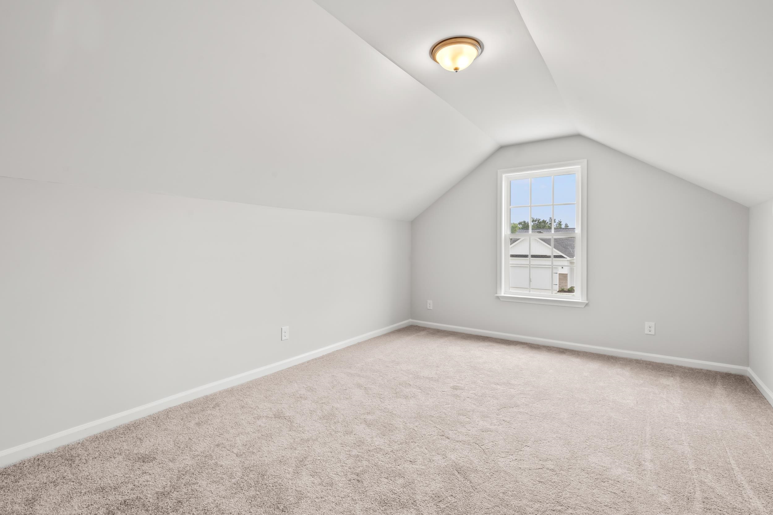 231 Stillbrook Drive Longs, SC 29568 - Photo 13 of 38 Bonus room with lofted ceiling and light carpet