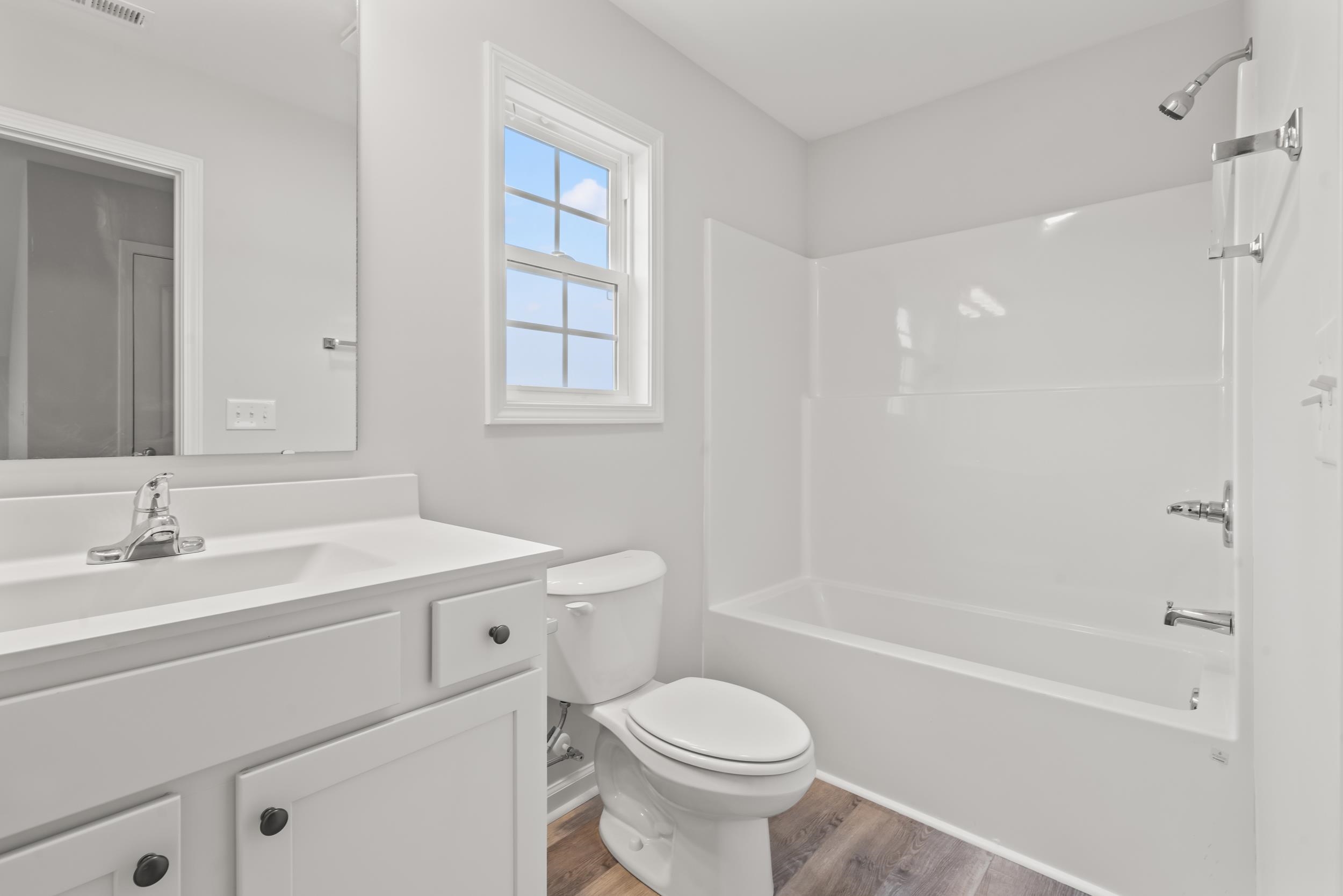 231 Stillbrook Drive Longs, SC 29568 - Photo 14 of 38 Bathroom with vanity, shower / bath combination, and light wood-type flooring