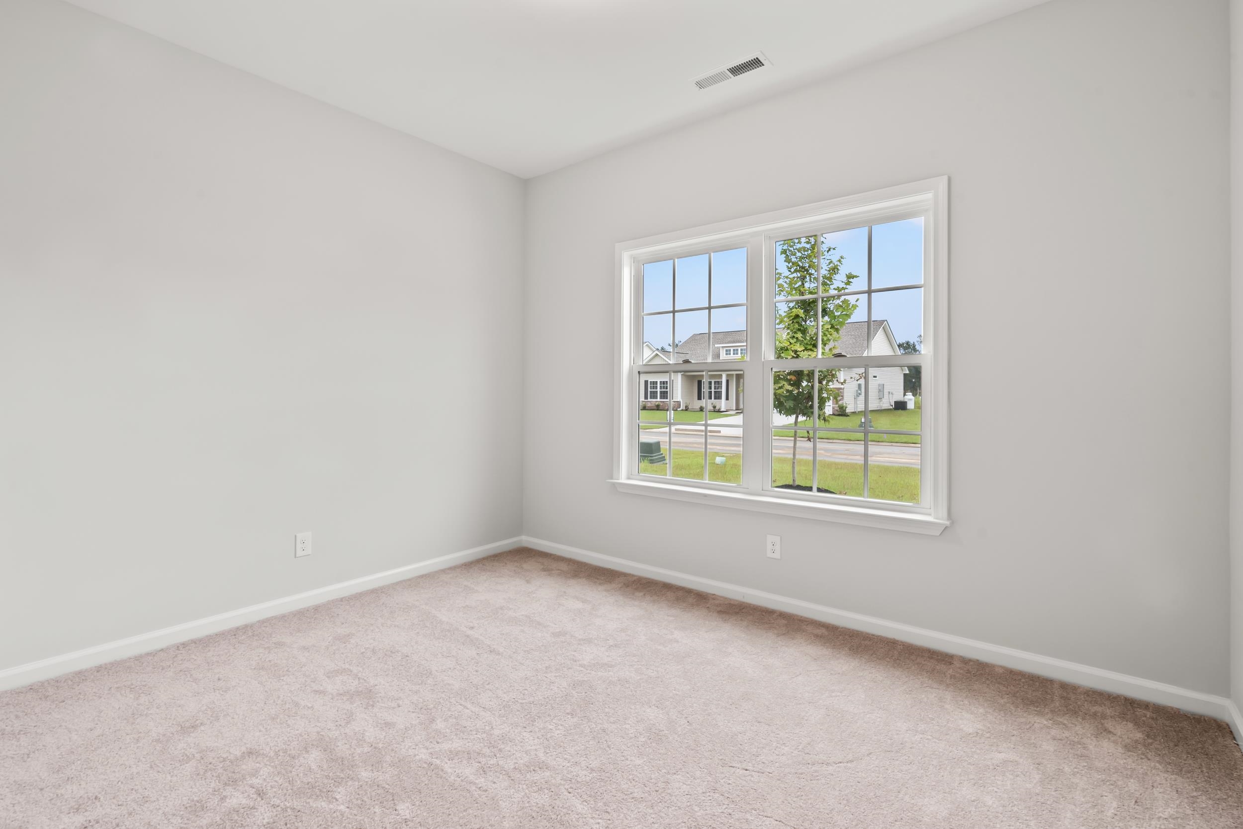 231 Stillbrook Drive Longs, SC 29568 - Photo 8 of 38 Unfurnished room with baseboards and light colored carpet