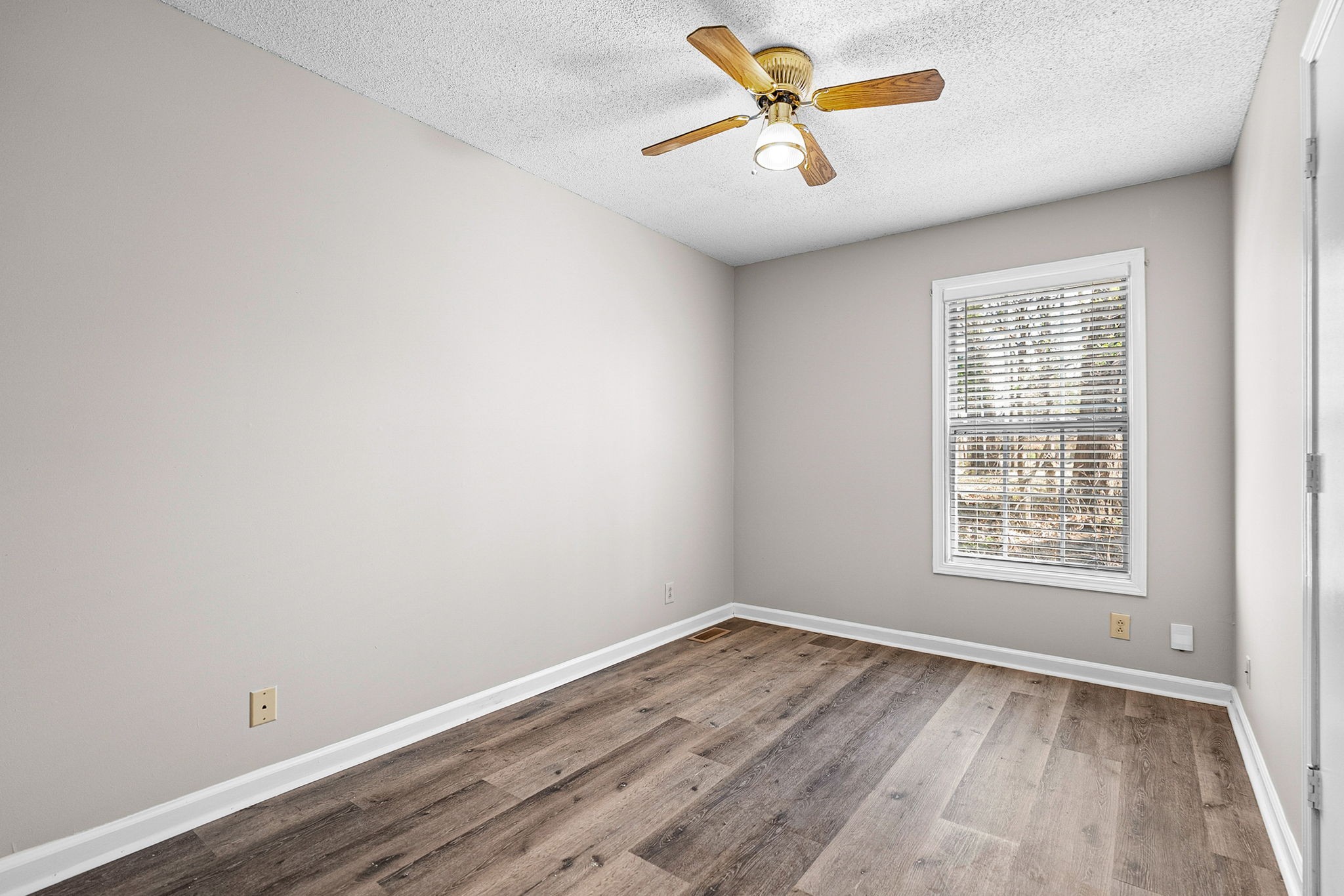 1539 Hugh Hunter Road Oak Grove, KY 42262 - Photo 14 of 22 an empty room with a window and a fan