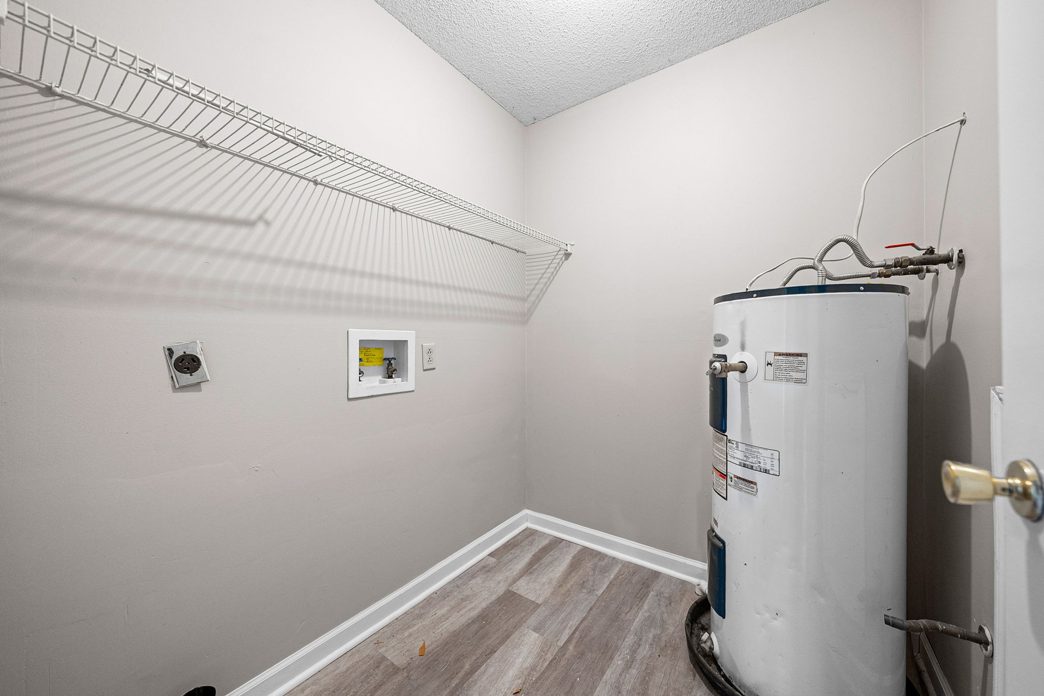 1539 Hugh Hunter Road Oak Grove, KY 42262 - Photo 20 of 22 a view of a room with wooden floor and a ceiling fan