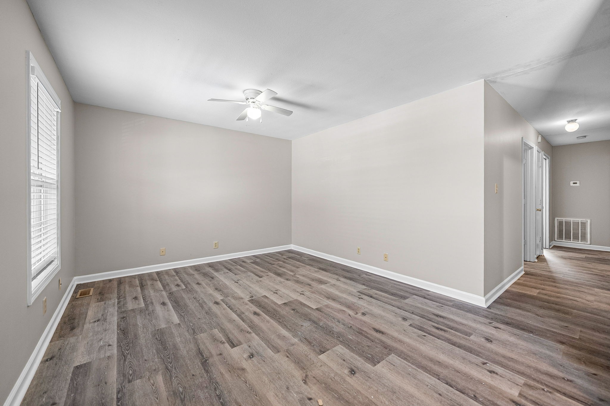 1539 Hugh Hunter Road Oak Grove, KY 42262 - Photo 4 of 22 wooden floor in an empty room with a window