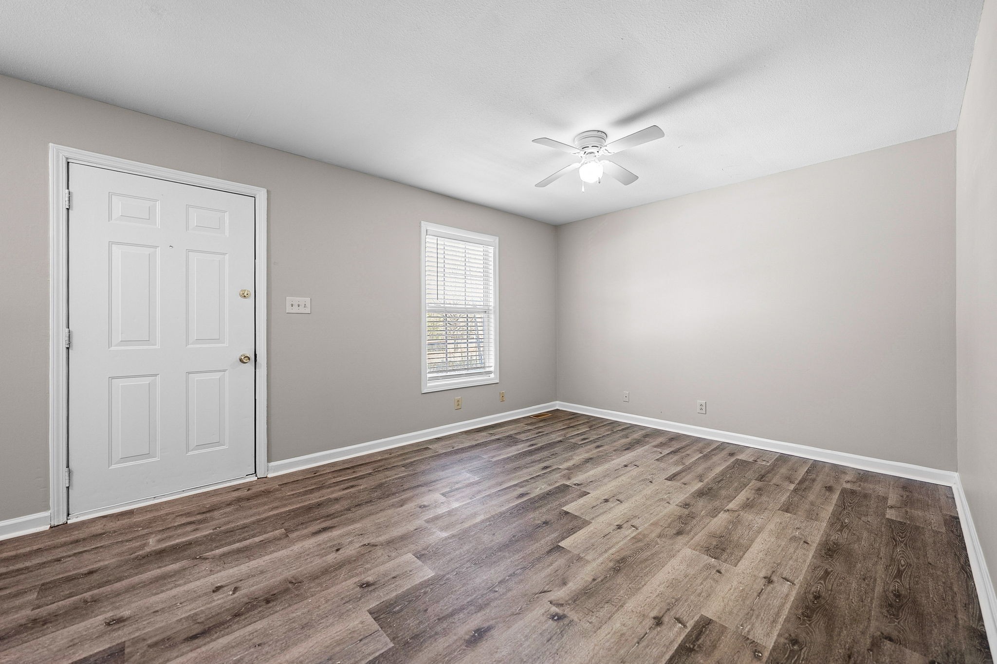 1539 Hugh Hunter Road Oak Grove, KY 42262 - Photo 7 of 22 wooden floor in an empty room with a window