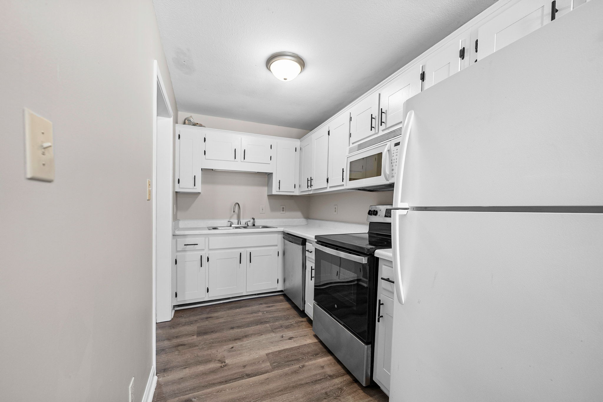 1539 Hugh Hunter Road Oak Grove, KY 42262 - Photo 9 of 22 a kitchen with stainless steel appliances granite countertop a refrigerator and a stove top oven