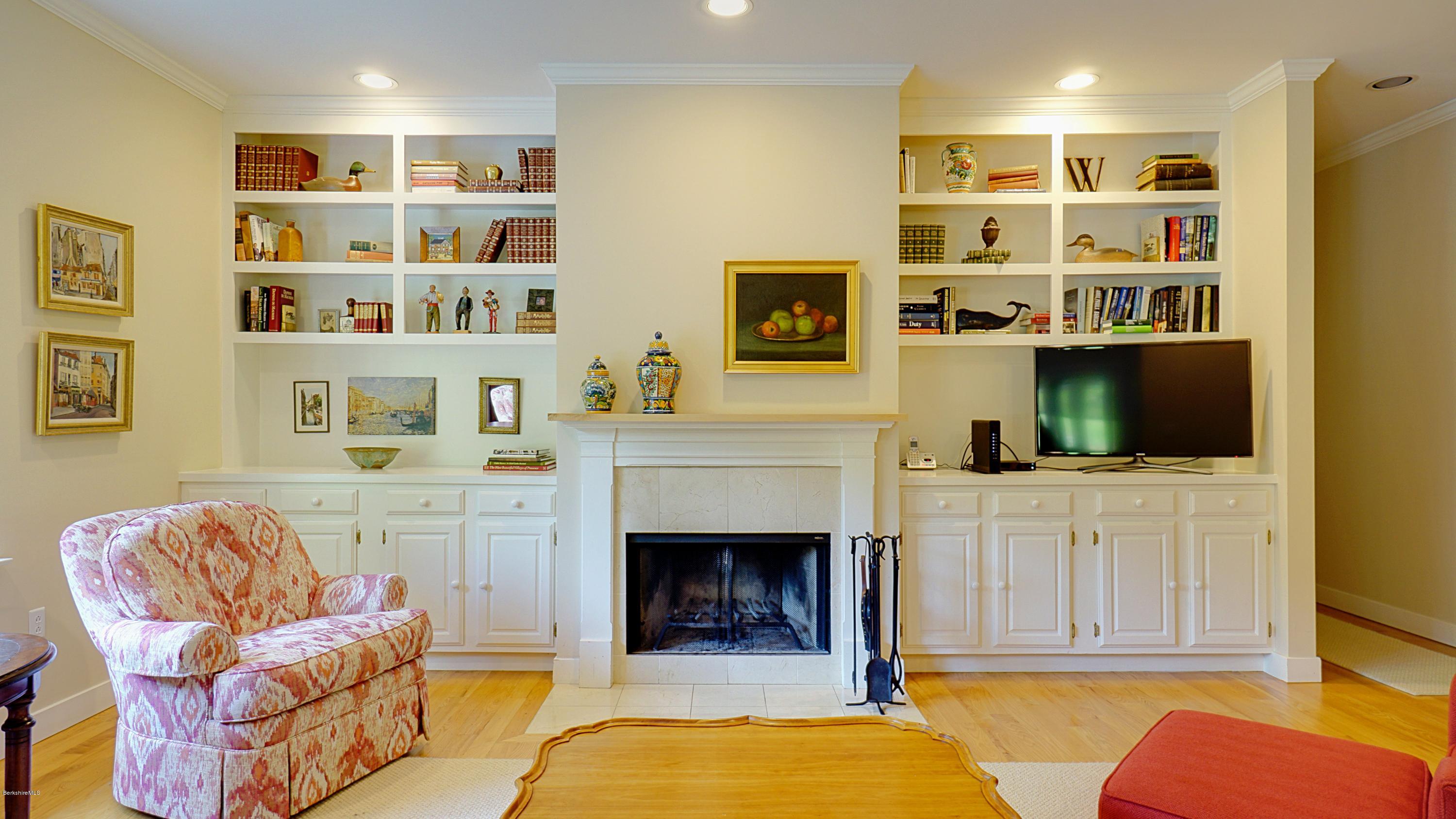 11 Prospect Hill Road, Unit 3 Stockbridge, MA 01262 - Photo 1 of 27 a living room with furniture fireplace and flat screen tv