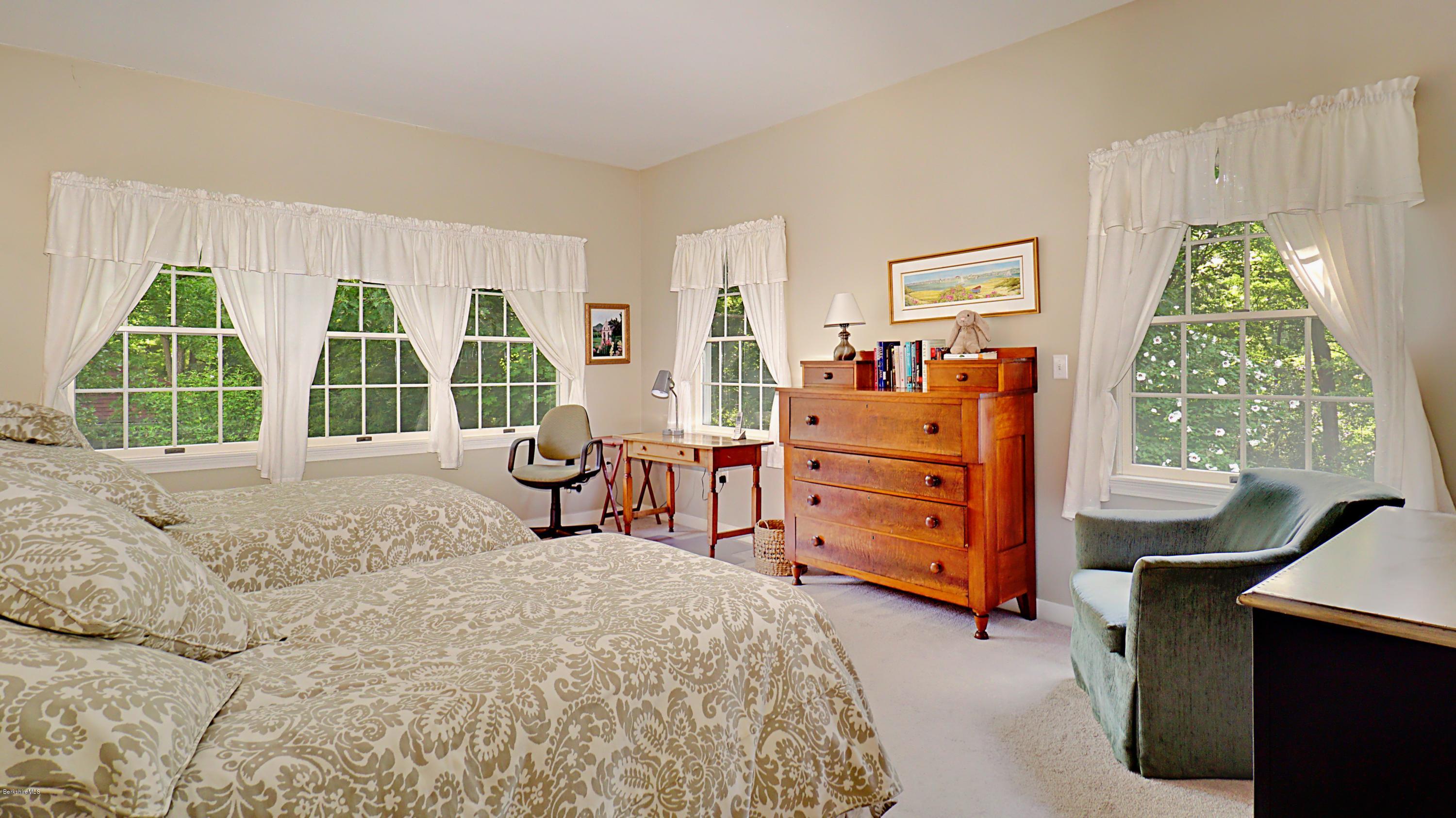 11 Prospect Hill Road, Unit 3 Stockbridge, MA 01262 - Photo 11 of 27 a bedroom with a bed and a dresser