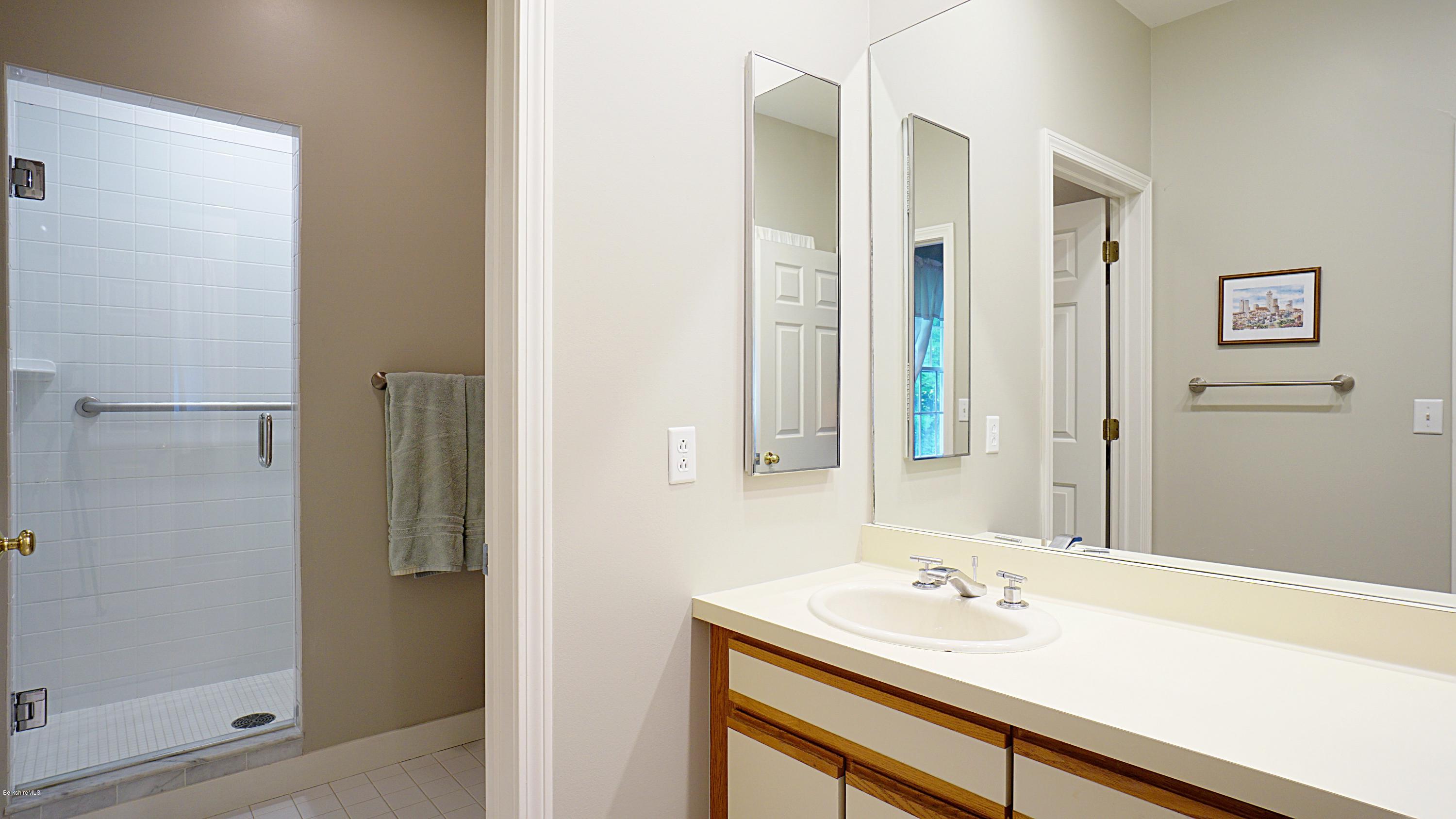 11 Prospect Hill Road, Unit 3 Stockbridge, MA 01262 - Photo 13 of 27 a bathroom with a sink and a mirror