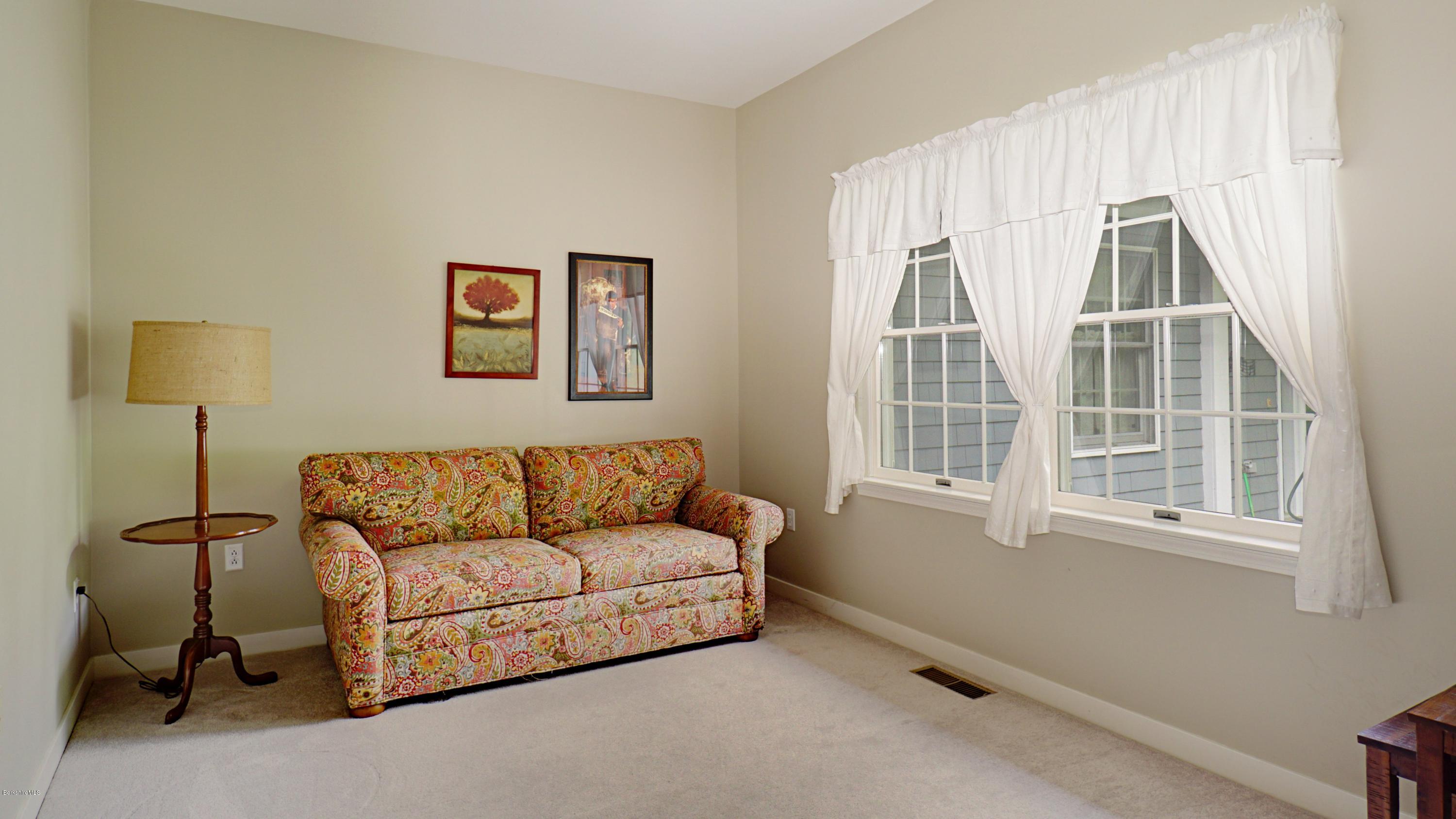 11 Prospect Hill Road, Unit 3 Stockbridge, MA 01262 - Photo 14 of 27 a living room with furniture and a window