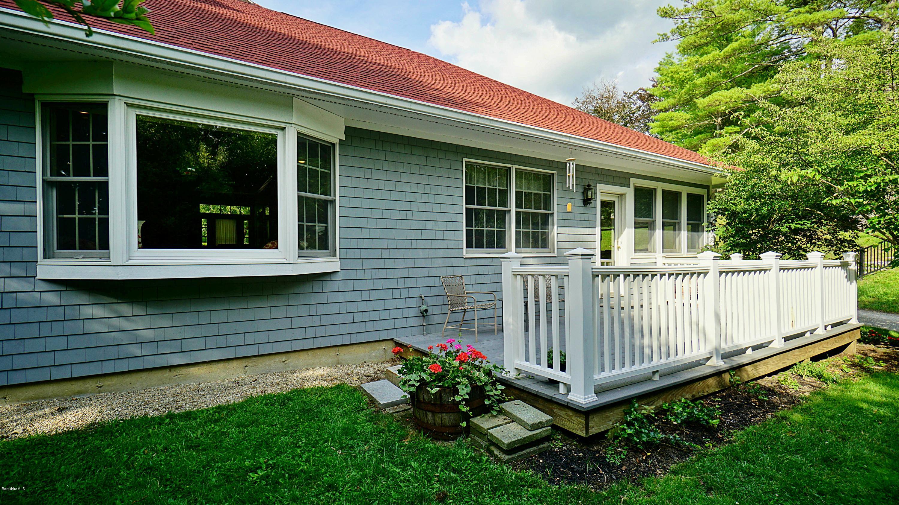 11 Prospect Hill Road, Unit 3 Stockbridge, MA 01262 - Photo 18 of 27 a front view of a house with a garden