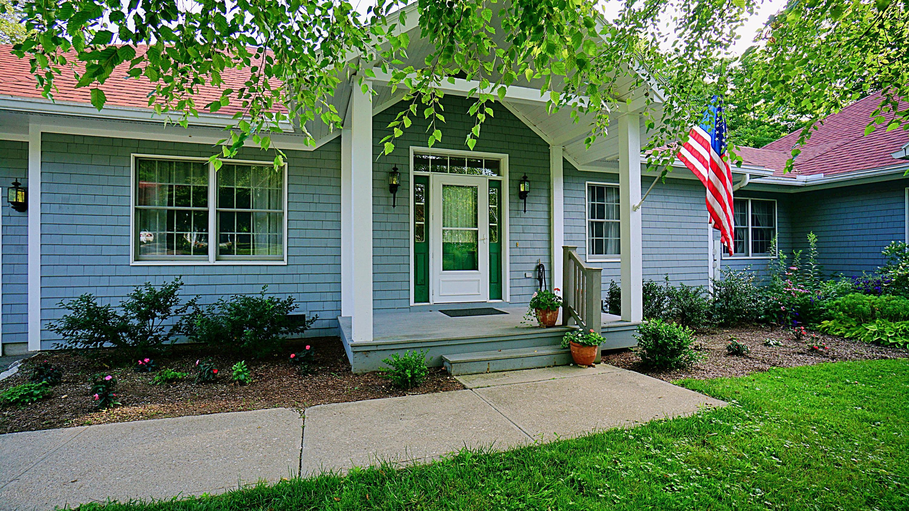 11 Prospect Hill Road, Unit 3 Stockbridge, MA 01262 - Photo 24 of 27 a front view of a house with garden
