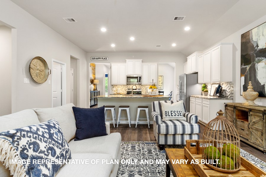 1421 Imperial Ranch Way Dayton, TX 77535 - Photo 4 of 19 a living room with furniture a flat screen tv and kitchen view
