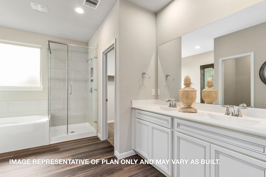 1421 Imperial Ranch Way Dayton, TX 77535 - Photo 7 of 19 a bathroom with a shower sink and mirror