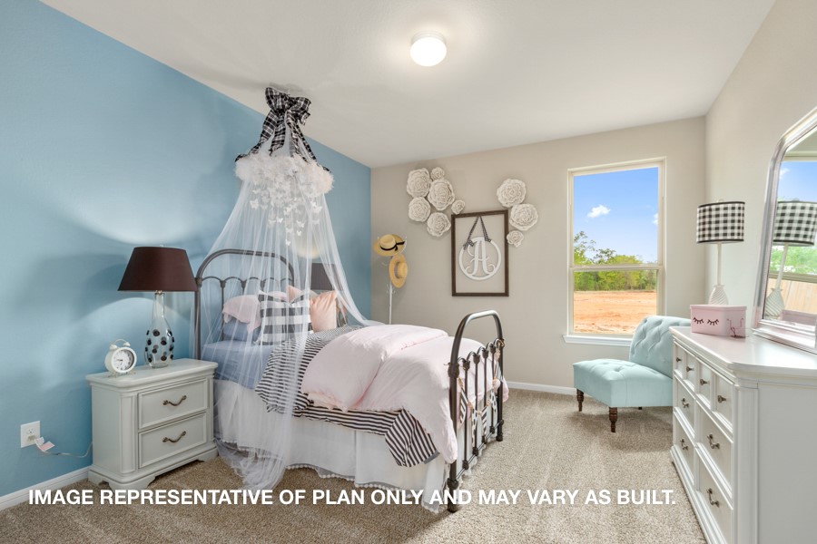 1421 Imperial Ranch Way Dayton, TX 77535 - Photo 9 of 19 a living room with furniture a table and decor