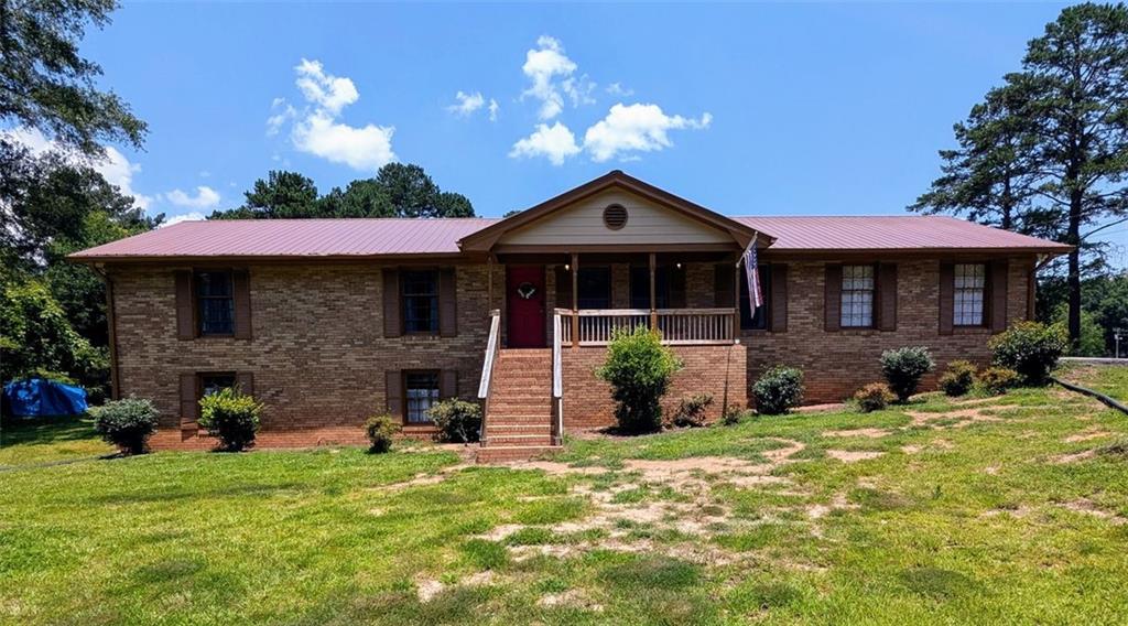 1848 Christian Circle Southeast Conyers, GA 30013 - Photo 1 of 11 a front view of a house with garden