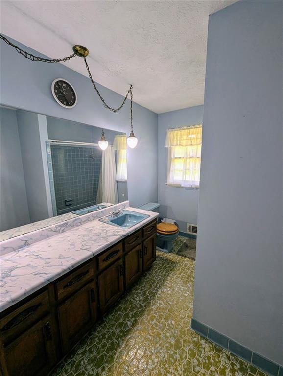 1848 Christian Circle Southeast Conyers, GA 30013 - Photo 4 of 11 a spacious bathroom with a granite countertop sink and a mirror