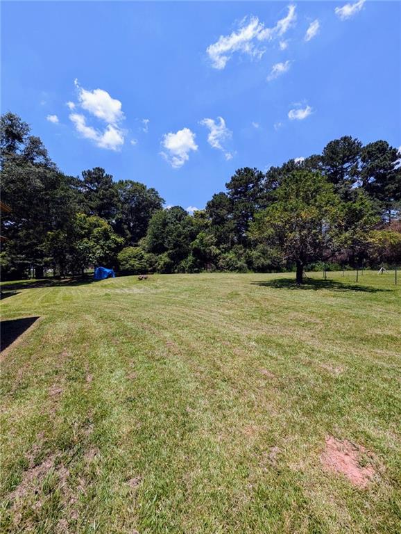 1848 Christian Circle Southeast Conyers, GA 30013 - Photo 10 of 11 a view of outdoor space with garden and trees
