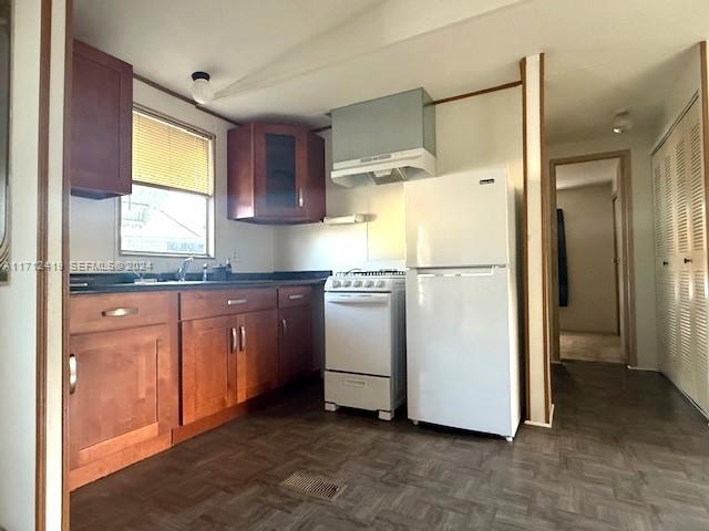 4510 Welcome Drive Sebring, FL 33870 - Photo 12 of 28 a kitchen with stainless steel appliances granite countertop a refrigerator a sink and a stove