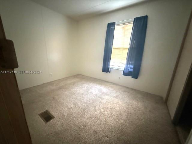 4510 Welcome Drive Sebring, FL 33870 - Photo 17 of 28 an empty room with windows