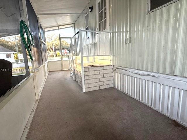 4510 Welcome Drive Sebring, FL 33870 - Photo 19 of 28 a view of a hallway with windows