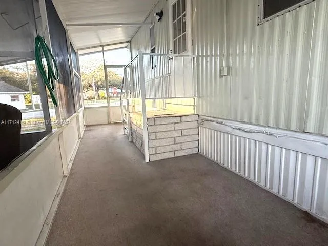 a view of a hallway with windows