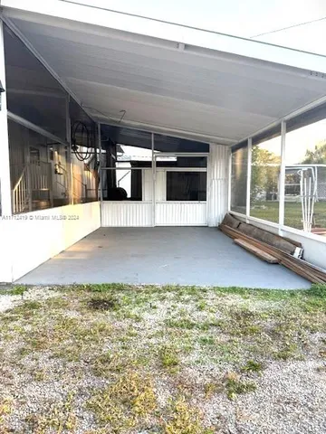 a view of a living room with a large window