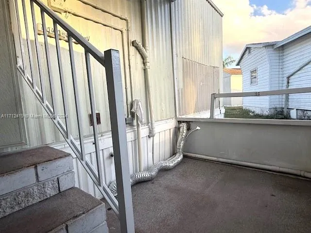 a view of a yard in front of a house with large tree