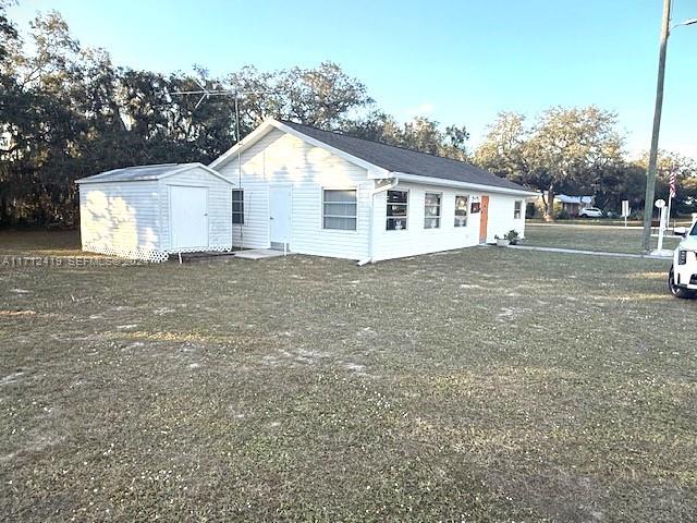 4510 Welcome Drive Sebring, FL 33870 - Photo 25 of 28 a view of a yard in front of a house with large tree