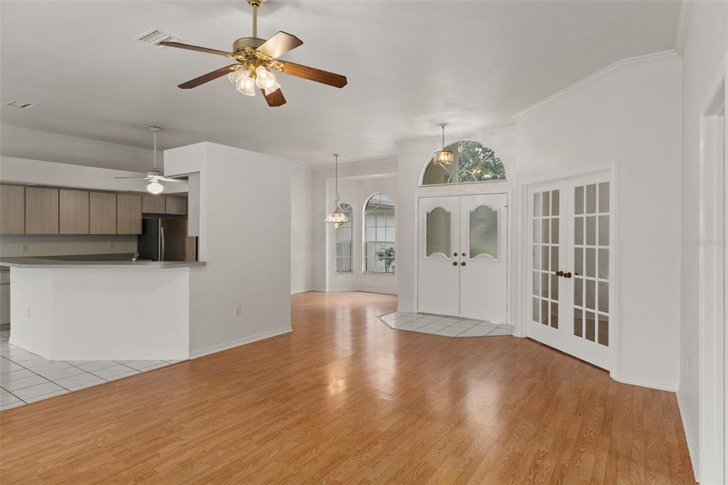 2214 Meadow Lark Road Spring Hill, FL 34608 - Photo 12 of 49 a view of an empty room with window and wooden floor