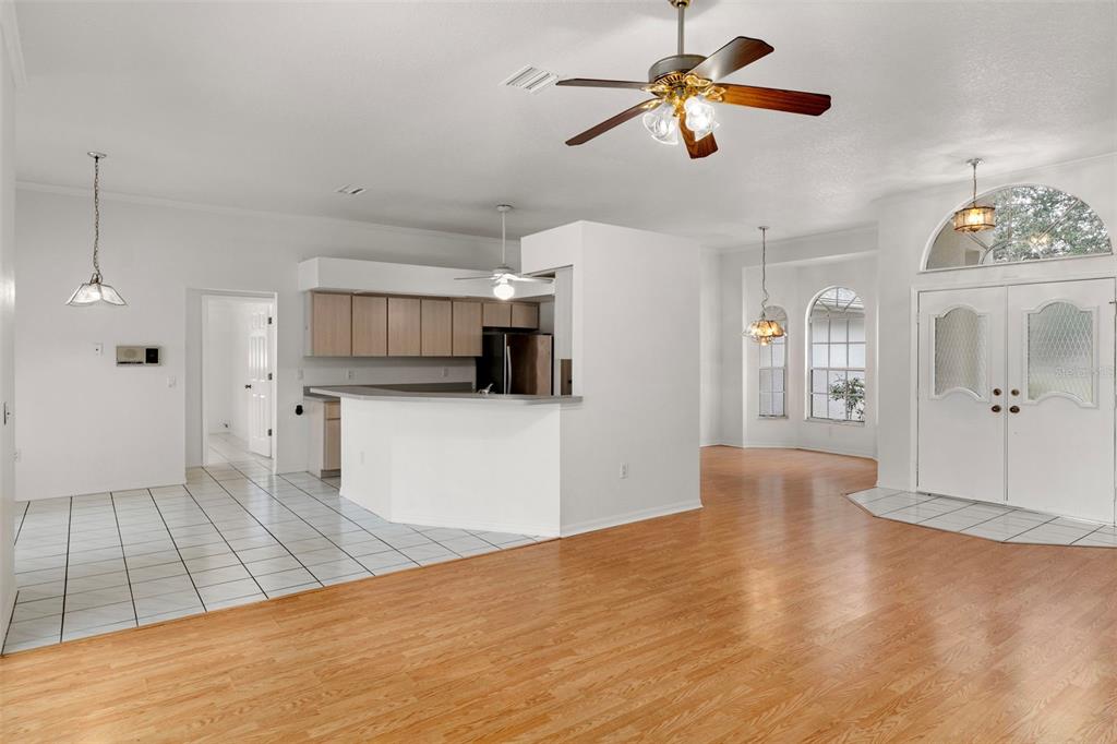 2214 Meadow Lark Road Spring Hill, FL 34608 - Photo 13 of 49 a view of a kitchen with wooden floor a sink a refrigerator and window