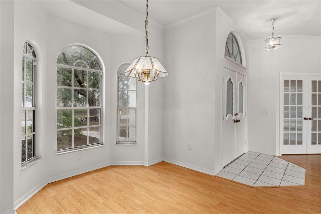 2214 Meadow Lark Road Spring Hill, FL 34608 - Photo 14 of 49 a view of an empty room with glass door and windows
