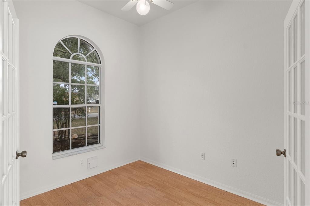 2214 Meadow Lark Road Spring Hill, FL 34608 - Photo 19 of 49 an empty room with a window